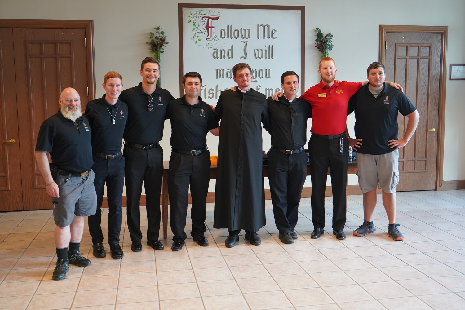 Seminarians Philip Novotney, Gage Niesen, Shane Kliethermes, John-Paul McGuire, Jacob Hartman, Gregory Clever, Christopher Hoffman and Bryce Smith of the Jefferson City diocese gather for a photo after the Aug. 6 Mass in St. Andrew Church.